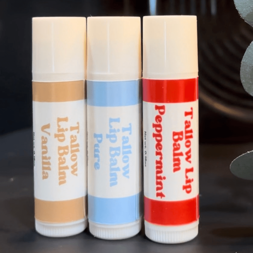 Naturallow Tallow Lip Balm, Vanilla, Pure and Peppermint tubes standing in a row
