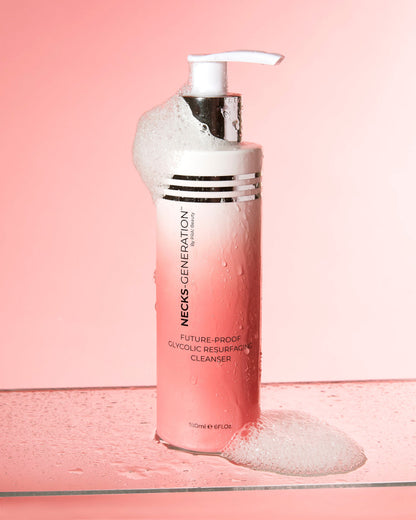 PRAI Beauty Necks-Generation Future-Proof Glycolic Resurfacing Cleanser, pump bottle with foam on a pink background