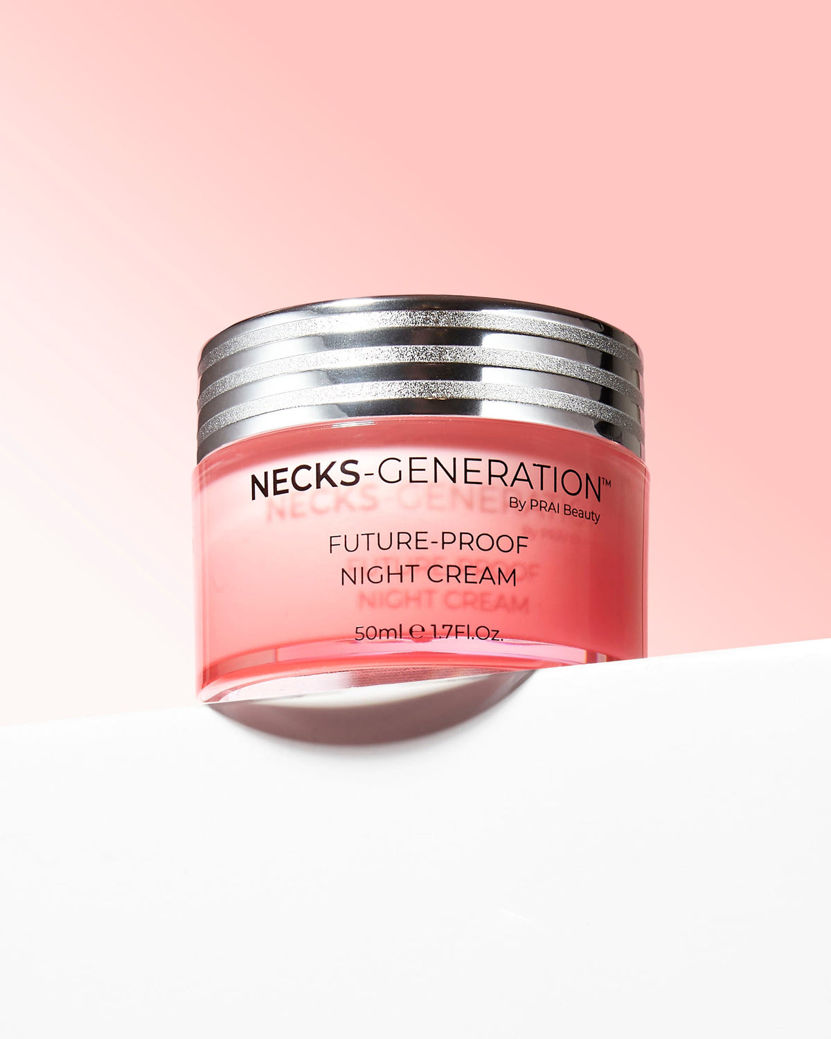 PRAI Beauty Necks-Generation Future-Proof Night Cream, jar on a pink background